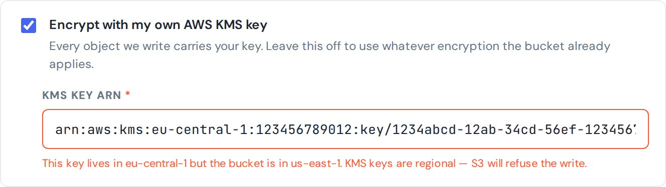 The KMS key ARN field showing an error: the key lives in eu-central-1 but the bucket is in us-east-1